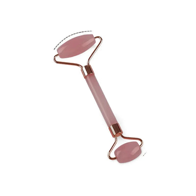 Rouleau de massage pour le visage en quartz rose, parfait pour réduire les gonflements et améliorer le drainage lymphatique.